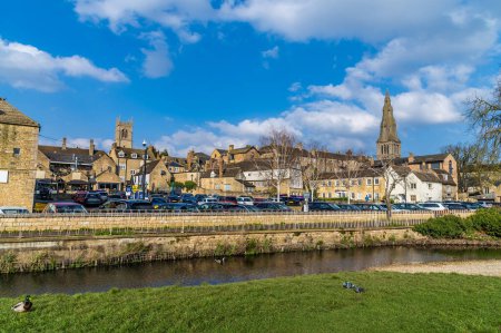 A view across the River Welland towards Saint Marys and Saint Johns Churches in Stamford, Lincolnshire, UK in springtime