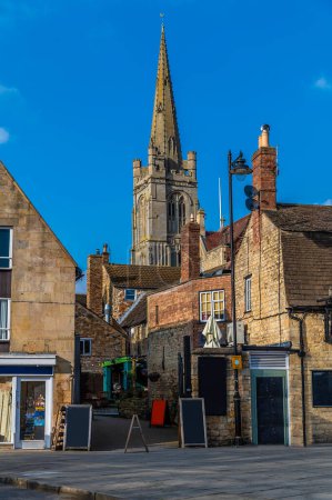 A view from the town centre towards All Saints Church in Stamford, Lincolnshire, UK in springtime