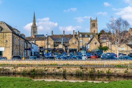A view across the River Welland towards All Saints and Saint Johns Churches in Stamford, Lincolnshire, UK in springtime