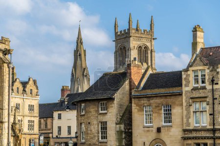 A view across the rooftops towards Saint Marys and Saint Johns Churches in Stamford, Lincolnshire, UK in springtime