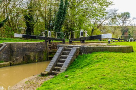 A view looking up at the Aylestone Mill lock on the Grand Union Canal in Aylestone Meadows, Leicester, UK in Springtime