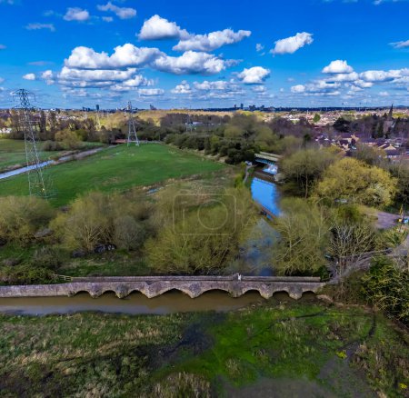 An aerial view over the packhorse bridge beside the Grand Union Canal in Aylestone Meadows, Leicester, UK in Springtime