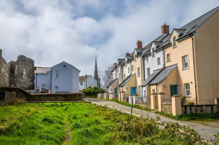 Photo for A view up a quiet street beside the castle ruins in Haverfordwest, Pembrokeshire, Wales on a spring day - Royalty Free Image