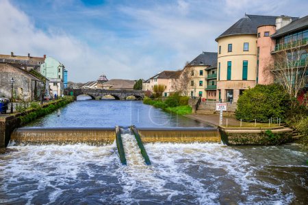 Photo for A view over the weir on the River Cleddau in Haverfordwest, Pembrokeshire, Wales on a spring day - Royalty Free Image