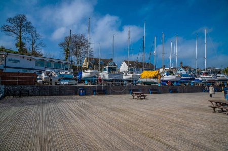 A view across the harbour decking in Saundersfoot, Wales on a bright spring day