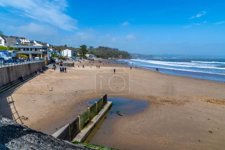 A view along the beach in the village of Saundersfoot, Wales on a bright spring day