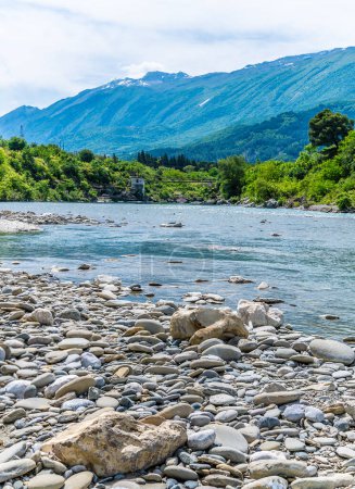 A view from the shoreline down the Vjosa River at Kelcyre, Albania in summertime