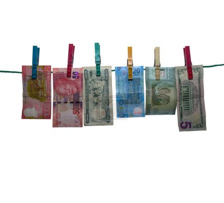 Foto de Six banknotes after money laundering to dry on a clothesline, isolated, white background - Imagen libre de derechos