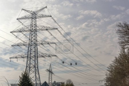Photo for A newly installed high-voltage pylon with some cables connected - Royalty Free Image
