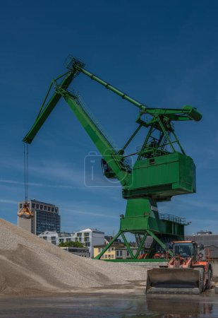 Photo for Exterior view of a cement factory with green crane - Royalty Free Image