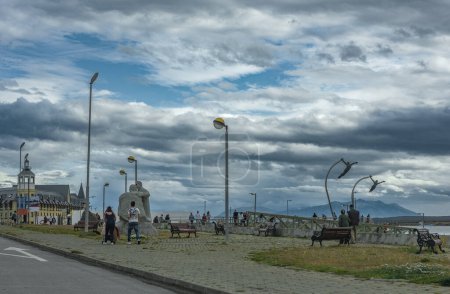 Photo for Unidentified pedestrians on the waterfront in Puerto Natales, Patagonia, Chile - Royalty Free Image