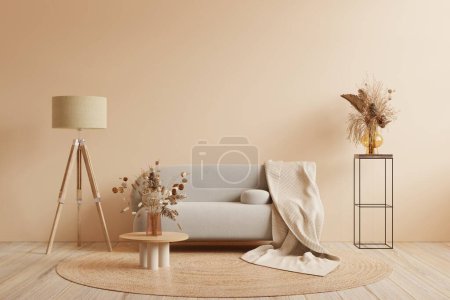 Téléchargez les photos : Intérieur de style Boho avec canapé gris et décor sur le mur de couleur crème. - en image libre de droit