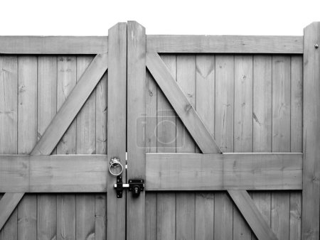 Photo for Wooden gates with lock and drop bolts in black and white - Royalty Free Image