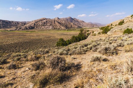 Photo for Captivating Oregon landscape with mountains, shrubland, and split rock formation. - Royalty Free Image