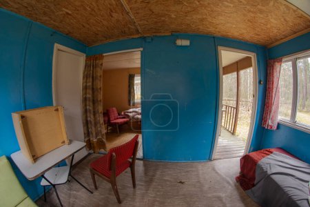 Photo for Abandoned camping cabin in a remote area on a cloudy day. - Royalty Free Image