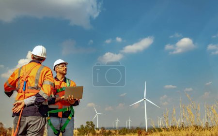 Photo for Architect engineer male surveyor team working with surveyor's telescope to measure heights of walk in areas surveying wind generating fields to plan road construction with professional tools. - Royalty Free Image