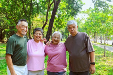 Cheerful enjoy group asian elderly retired people who are healthy and happy together participate in recreational activities garden play sport exercise have fun morning have good mood  live long life.