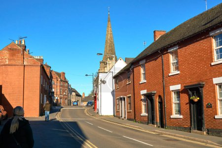 Photo for Sloping road and church in Uttoxeter, Staffordshire, UK - Royalty Free Image