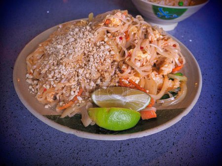 Photo for Pad thai, phat thai, or phad thai is a stir-fried rice noodle dish commonly served as a street food in Thailand - Royalty Free Image