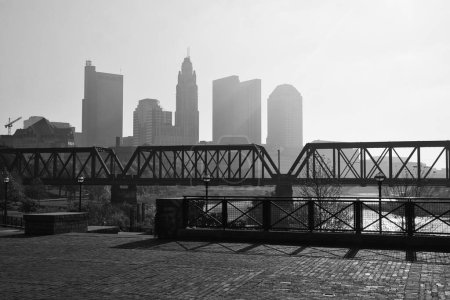 Photo for Foggy morning Scioto River Downtown Columbus Ohio Railway bridge - Royalty Free Image
