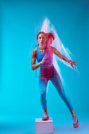 Photo for A sportswoman doing box jumps and exercising. Long exposure capture movement. - Royalty Free Image