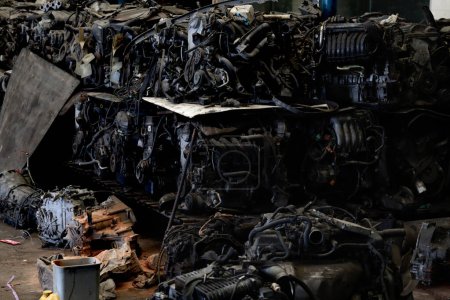 Auto parts and secondhand engine components in auto spare parts store. Spare parts of vehicle in warehouse. 