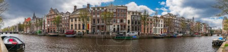 Photo for Panorama on the Amstel river in autumn in Amsterdam in Holland, Netherlands - Royalty Free Image