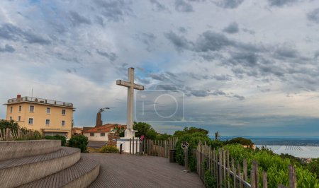 Photo for The huge white cross of Mont Saint Clair, overlooking the lagoon and the sea, and protecting the city of Sete, Occitanie, France - Royalty Free Image