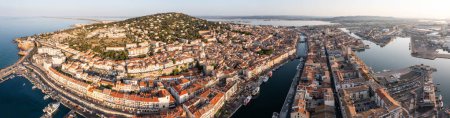 Photo for Aerial panoramic of the city of Sete at sunrise, in Occitanie, France - Royalty Free Image