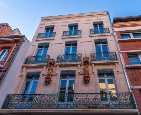 Facades of houses in Toulouse in Occitanie, France
