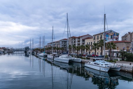Photo for Facades of buildings and sailboats at the Quai d'Orient, in Sete in Occitanie, France - Royalty Free Image