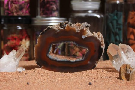 Téléchargez les photos : Agatized Coral With Quarts Crystals on Australian Red Sand. Meditation Table - en image libre de droit