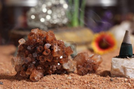 Photo for Chakra Stones With Aloe Vera Plants and Incense Cones on Australian Red Sand - Royalty Free Image