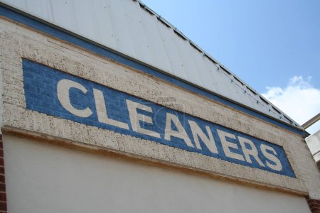 Photo for Vintage Cleaners Sign on Historic Brick Building Front - Royalty Free Image