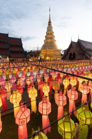 Photo for Blur background of Lantern Festival held inside famous temple in Lamphun is decorated with Lanna style paper lanterns during  Loi Krathong Festival an homage to Buddha in Buddhism using paper lanterns - Royalty Free Image