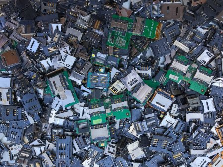SIM card trays and SD card trays removed from mobile phones are e-waste parts that can be used to extract precious metals. Many SIM card tray backgrounds and SD card trays have Copy Space for Text