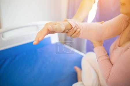 Photo for Physical therapists are helping elderly people to take care of themselves after a long period of recovery and they need regular physical therapy to help their bodies recover. physical therapy concept - Royalty Free Image