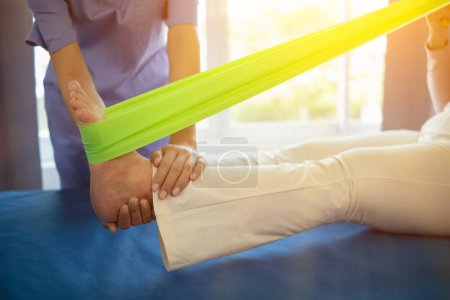 Photo for Physical therapists are helping elderly people to take care of themselves after a long period of recovery and they need regular physical therapy to help their bodies recover. physical therapy concept - Royalty Free Image