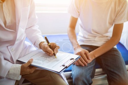 Photo for Doctor is having consultation discussing prostate cancer and venereal cancer detected in young man. Current doctors provide advice and counseling on detecting prostate cancer and treating it properly. - Royalty Free Image