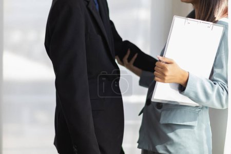 Photo for Manager is harassing his secretary in office after calling his secretary to discuss work which is considered a threatening act Sexuality in workplace. concept Anti harassmentSexuality in workplace - Royalty Free Image