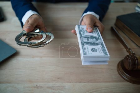 The concept of defendants in serious cases bribing officials involved in court decisions to change the course of case by giving bribes to facilitate the Lawyer team and prosecutors. bribery concept