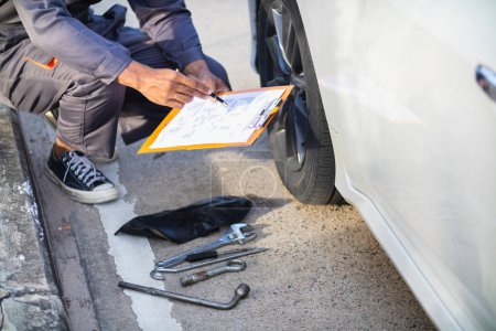 Technicians from service center inspect and assist customers cars that are having problems while traveling build confidence in customers who choose buy car from service center and receive help quickly