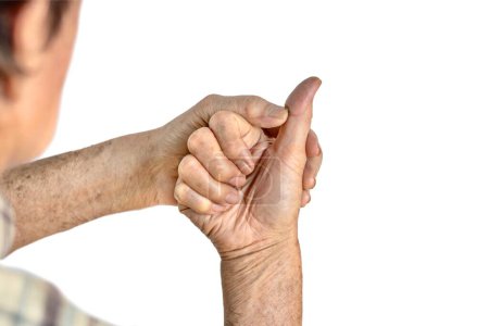 Photo for Pressing the thumb muscle for relieving pain. Finger injury. - Royalty Free Image