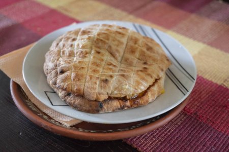 Lepinja, a traditional flat bread from Serbia, a yeast-raised, spongy flatbread that's popular all over the Balkans and similar to pide or pitta. 