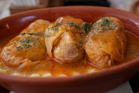 Photo for Sarma, the signature dish of the Balkans, pickled cabbage leaves stuffued with beef - Royalty Free Image