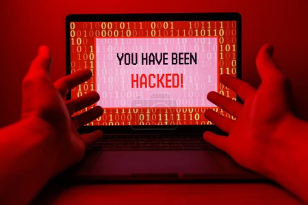 Foto de Hacker attack on Computer. Alert text on PC You have been hacked. High quality photo - Imagen libre de derechos
