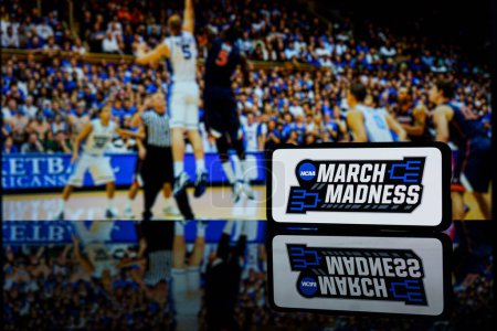 Photo for Kaunas, Lithuania - 2023 March 13: March madness logo on screen and NCAA basketball game play on TV in the background. High quality photo - Royalty Free Image