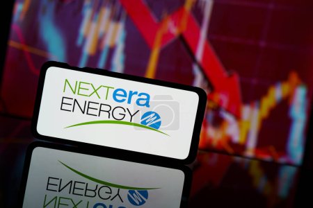 Photo for Paris, France - 2023 March 13: Nextera energy company shares go down at stock market. Nextera energy company financial crisis and failure. Economy collapse - Royalty Free Image