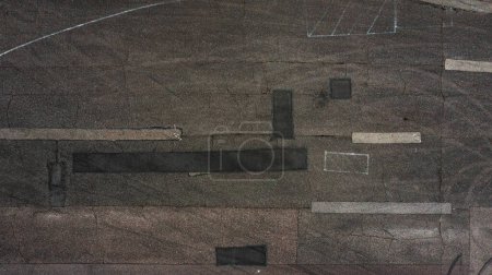 Photo for The texture of old and worn out asphalt. Drone view of old road. High quality photo - Royalty Free Image