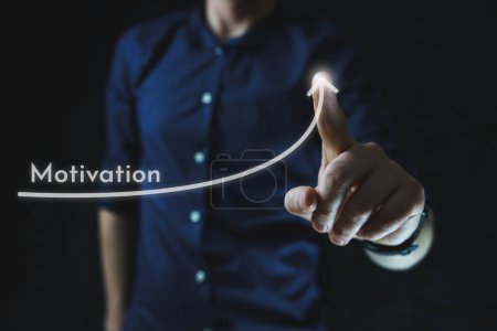 Man points with finger at growing motivation arrow. The concept of motivation. High quality photo
